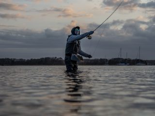 Kevin Blinkoff searching for stripers with a fly rod in early May.